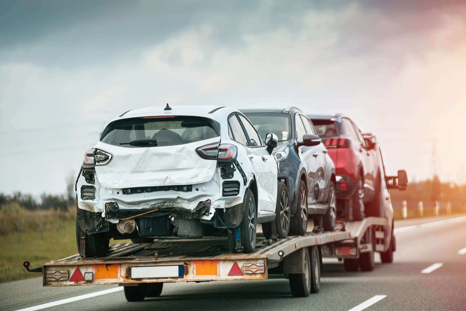cars on a tow truck