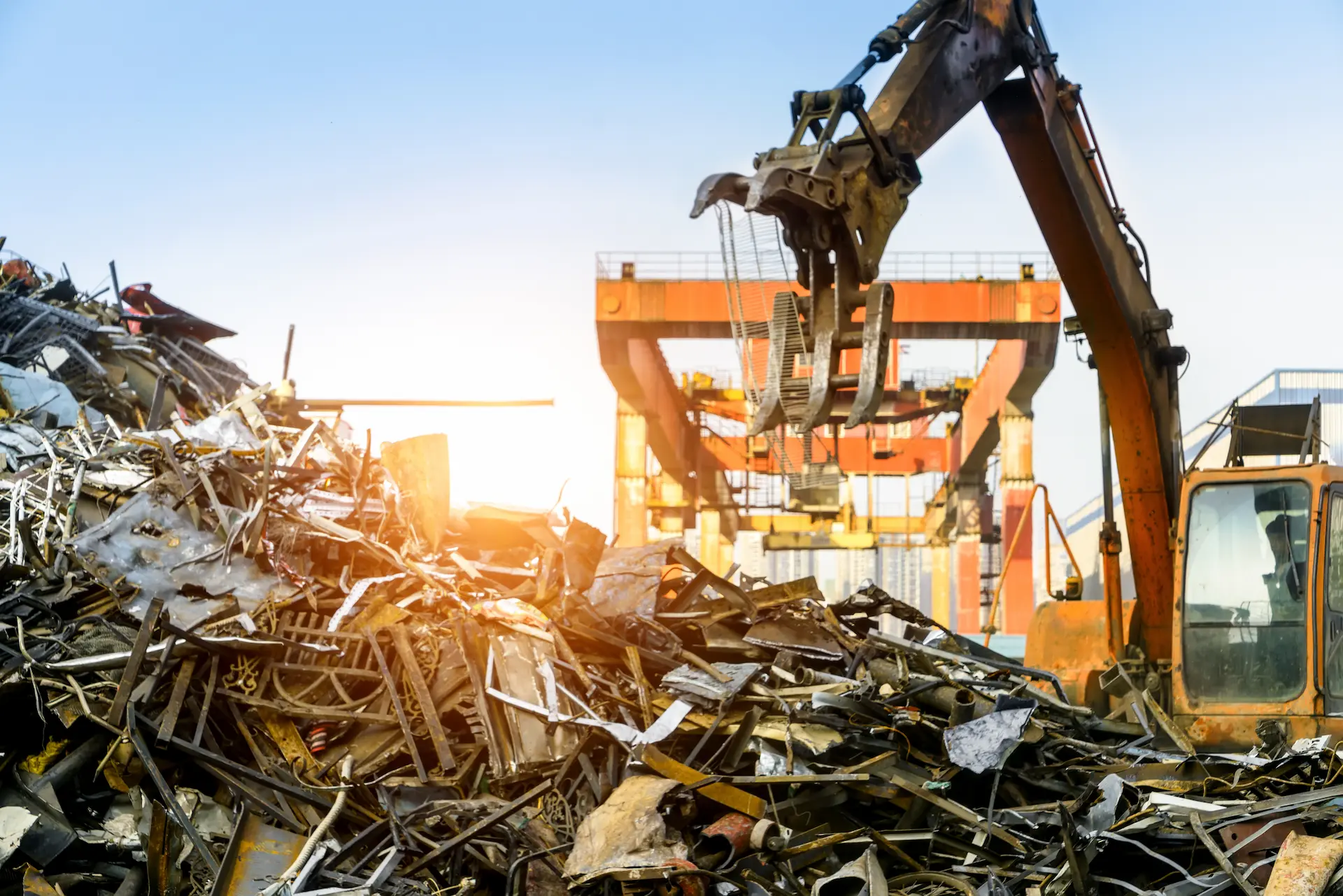 picking up recycled metal
