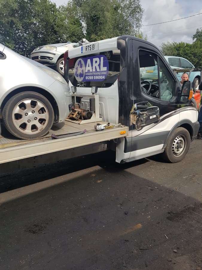 tow truck collecting scrap cars