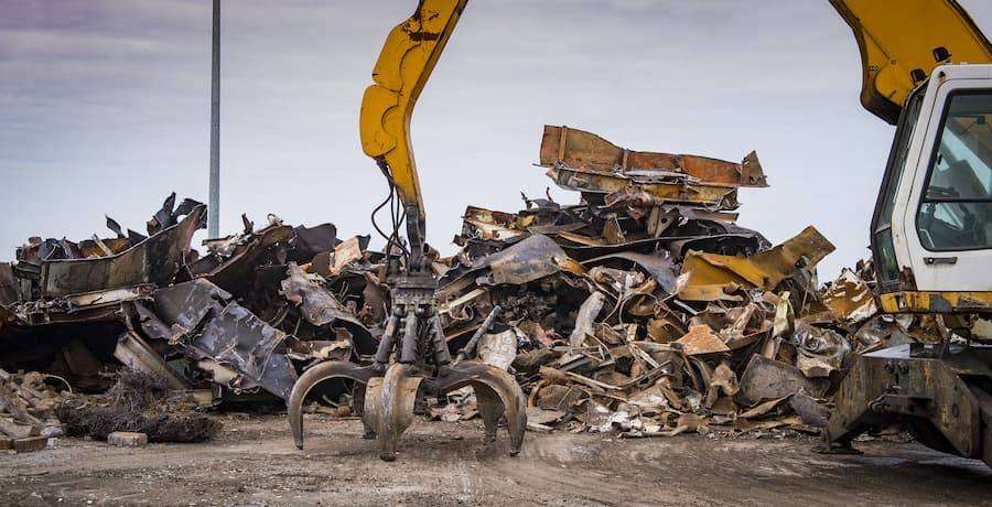 Machine Making Pile In Scrap Yard