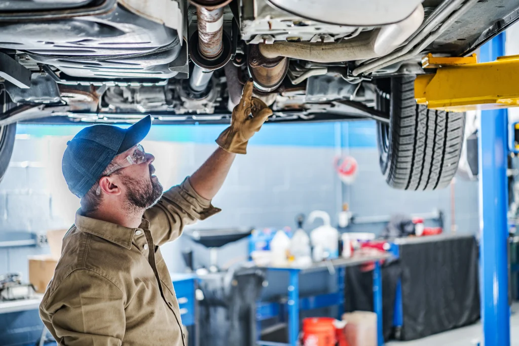 Mechanic Inspecting Car